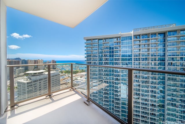 balcony featuring a water view