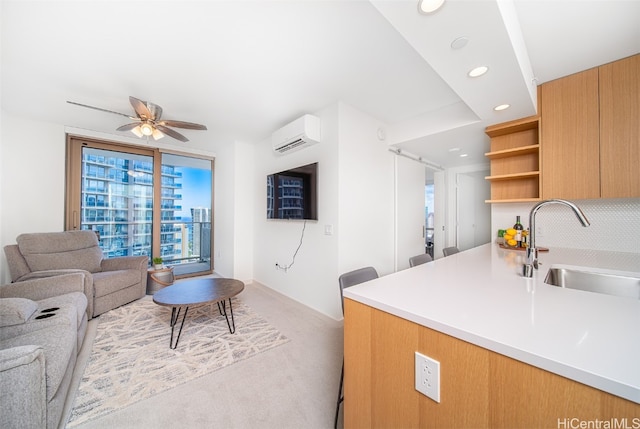 living room with sink, a wall mounted AC, light carpet, and ceiling fan