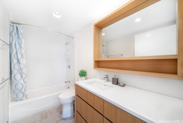 full bathroom featuring vanity, toilet, shower / bath combo with shower curtain, and tile patterned flooring