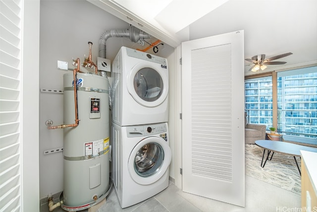 laundry room with water heater, light tile patterned flooring, stacked washer and clothes dryer, and ceiling fan