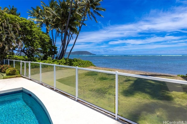 view of pool with a water view