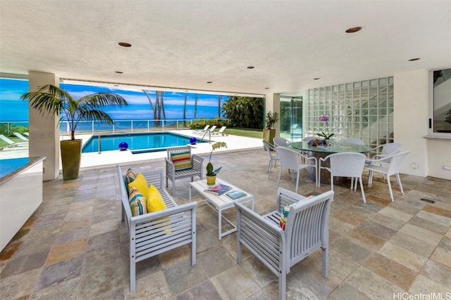 view of patio featuring a fenced in pool and an outdoor hangout area