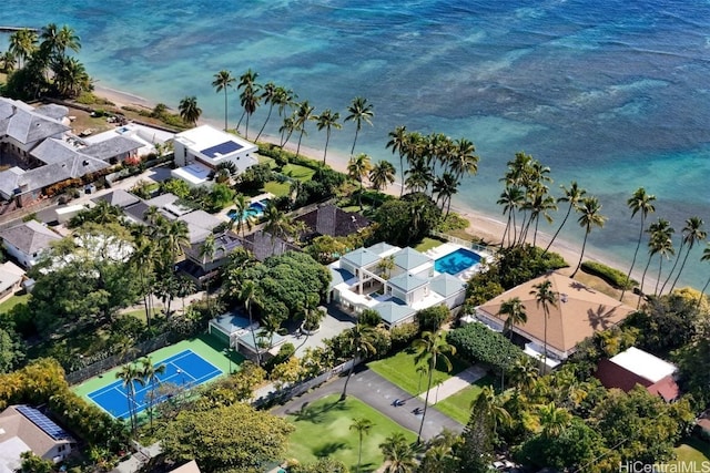 drone / aerial view featuring a water view and a view of the beach