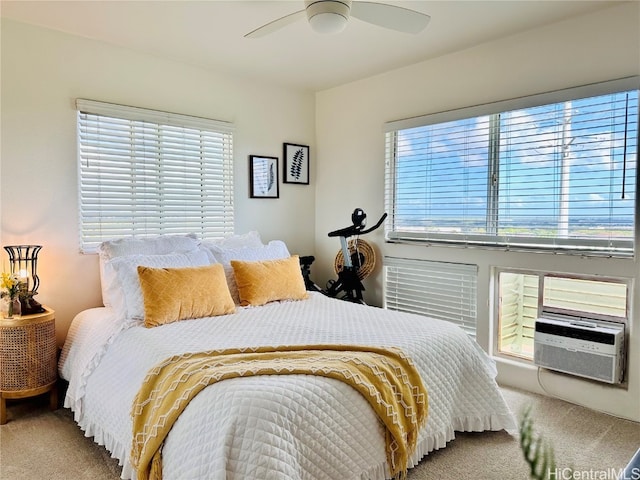 carpeted bedroom with multiple windows, cooling unit, and ceiling fan