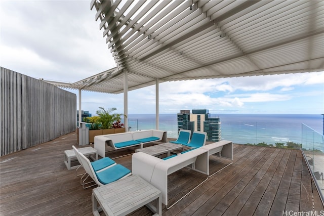 deck featuring a pergola, a water view, and an outdoor hangout area