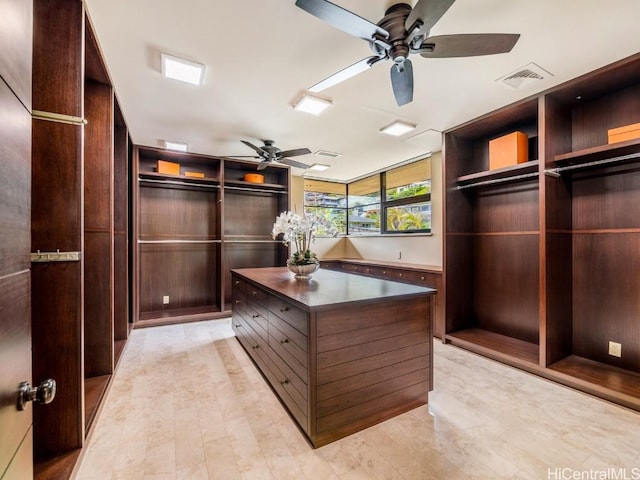 spacious closet with ceiling fan