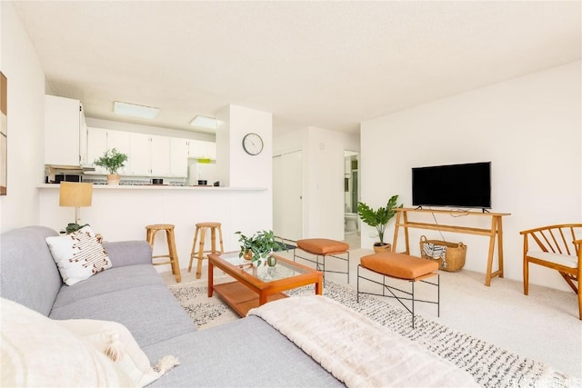 living room with light colored carpet