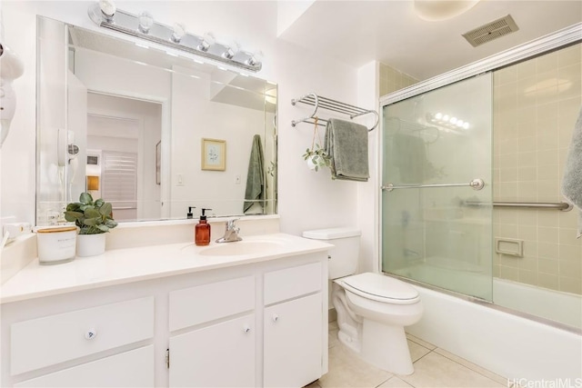 full bathroom with enclosed tub / shower combo, tile patterned flooring, toilet, visible vents, and vanity