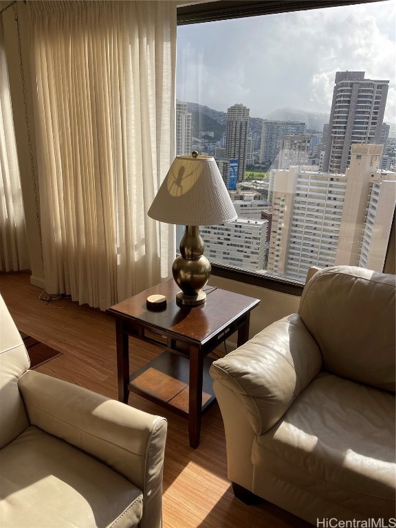 living area with hardwood / wood-style flooring