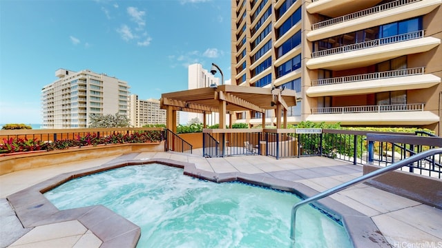 view of pool featuring a hot tub and a pergola