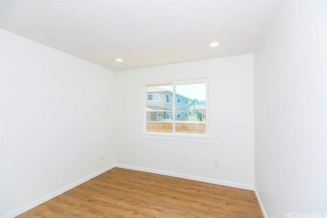 unfurnished room with light hardwood / wood-style floors