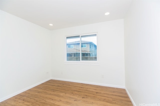 spare room featuring hardwood / wood-style floors