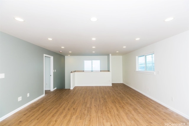 unfurnished living room with light hardwood / wood-style floors