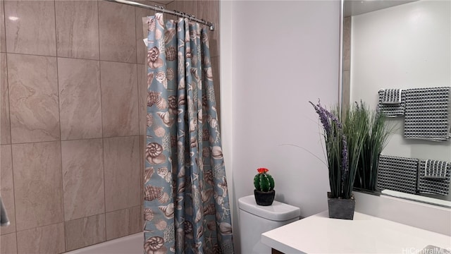 full bathroom with toilet, shower / tub combo with curtain, and vanity