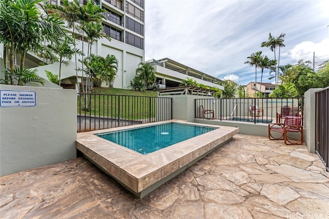 view of swimming pool featuring a patio area