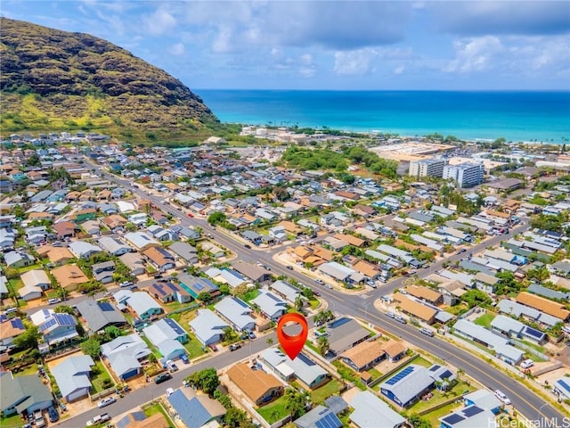 birds eye view of property with a water view and a residential view