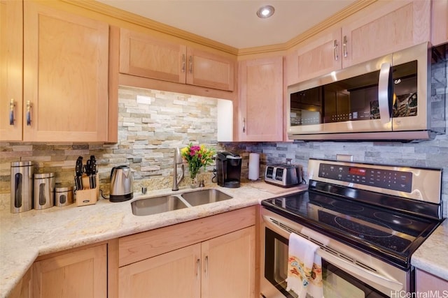 kitchen featuring decorative backsplash, light brown cabinetry, light stone counters, stainless steel appliances, and sink