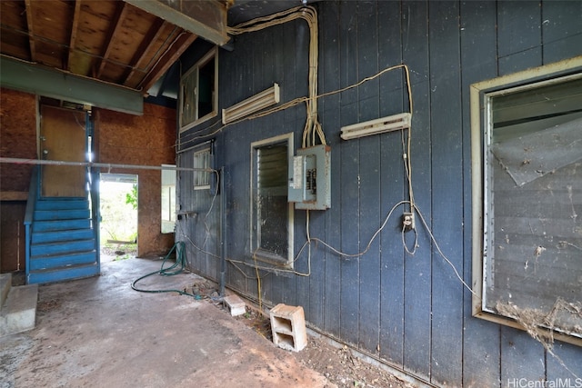 view of side of property with electric panel