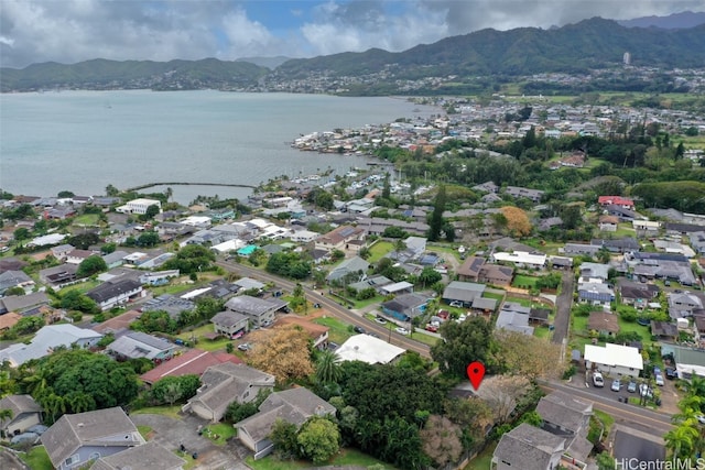 aerial view featuring a water and mountain view