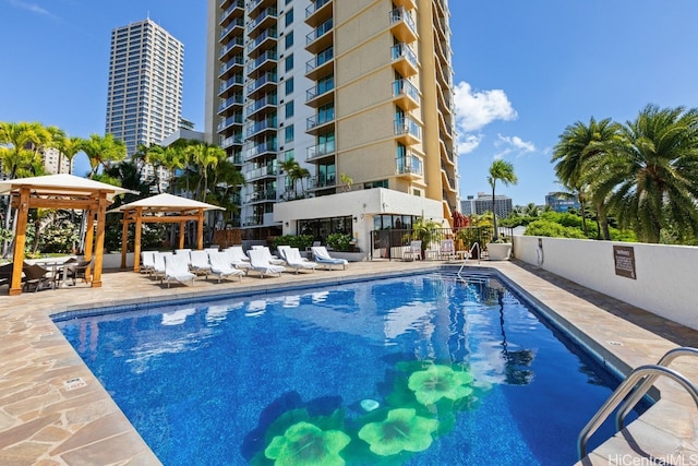 view of pool featuring a gazebo and a patio area