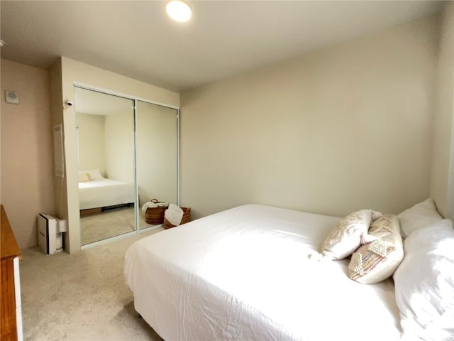 carpeted bedroom with a closet