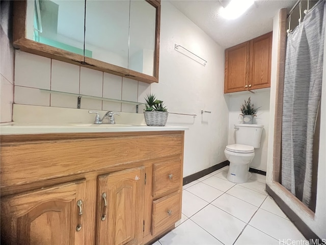 bathroom with vanity, toilet, tile patterned floors, and a shower with curtain