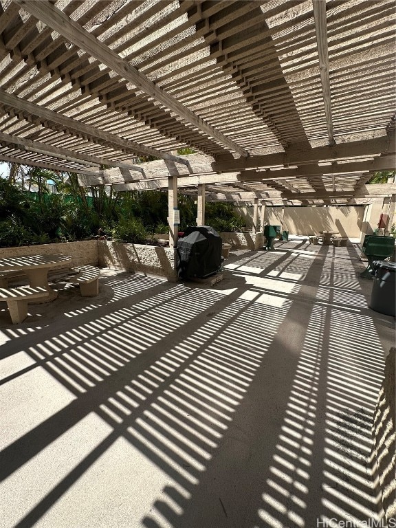 view of patio / terrace with area for grilling and a pergola