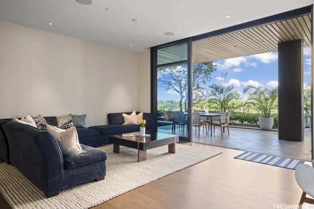 living room with hardwood / wood-style floors and expansive windows