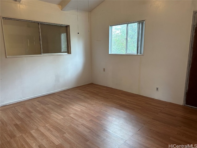 spare room with light wood-type flooring