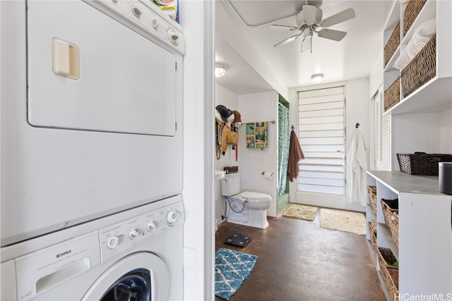 laundry area with stacked washer / dryer and ceiling fan