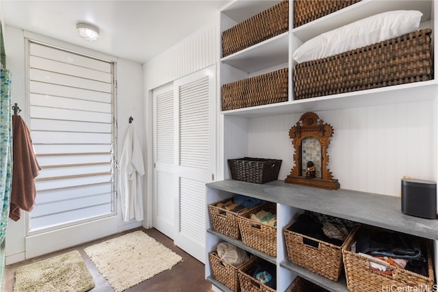 mudroom with wood walls