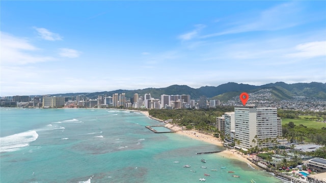 property view of water featuring a mountain view and a beach view