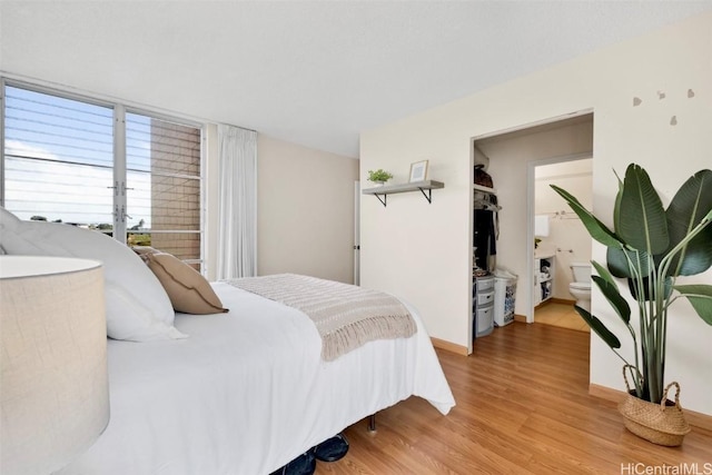 bedroom with hardwood / wood-style flooring