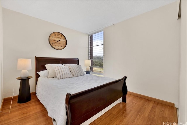 bedroom with light hardwood / wood-style flooring