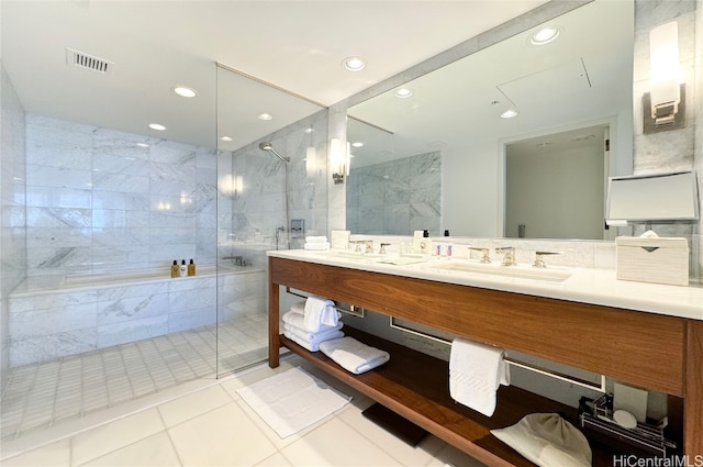 bathroom with vanity, tile patterned floors, independent shower and bath, and tile walls