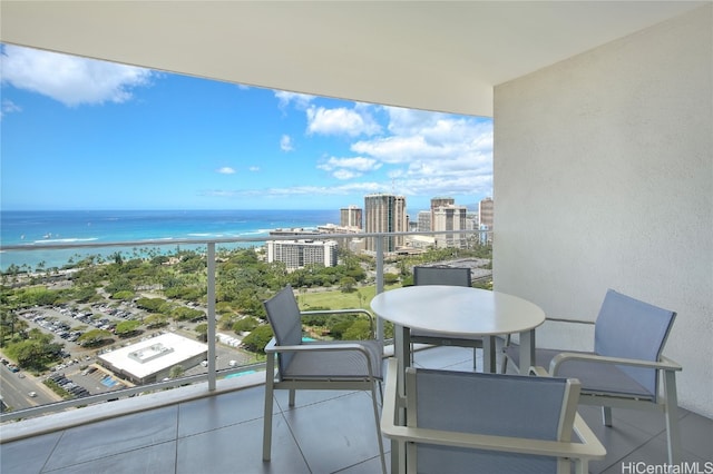 balcony featuring a water view