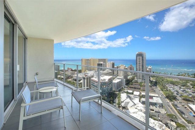 balcony featuring a water view