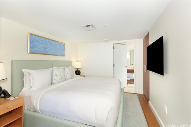 bedroom featuring light hardwood / wood-style floors