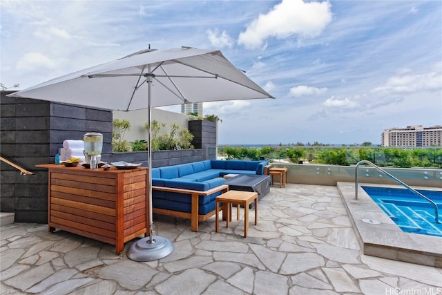 view of patio with a hot tub and an outdoor living space