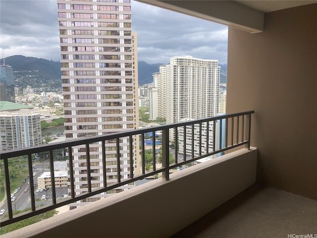 balcony featuring a view of city and a mountain view