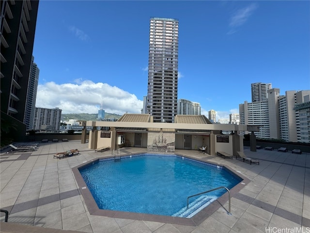 view of swimming pool featuring a patio area