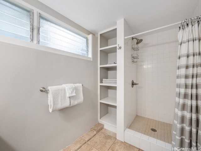 bathroom with tile patterned floors and a shower with shower curtain