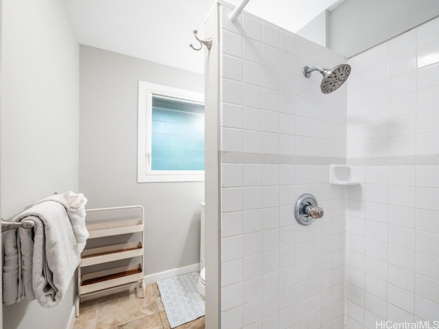 bathroom with a tile shower