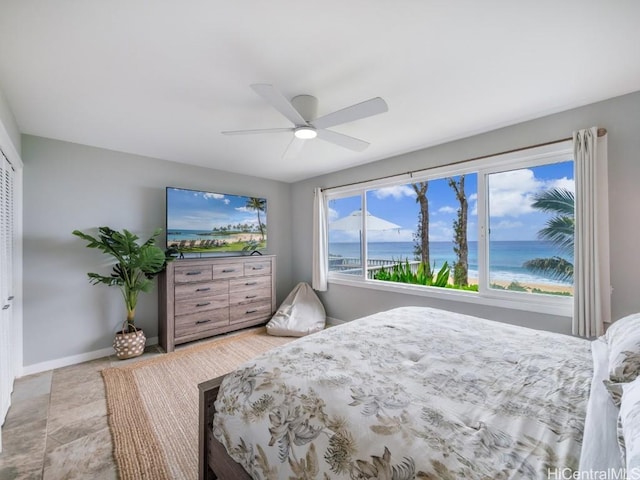 bedroom featuring ceiling fan and a closet