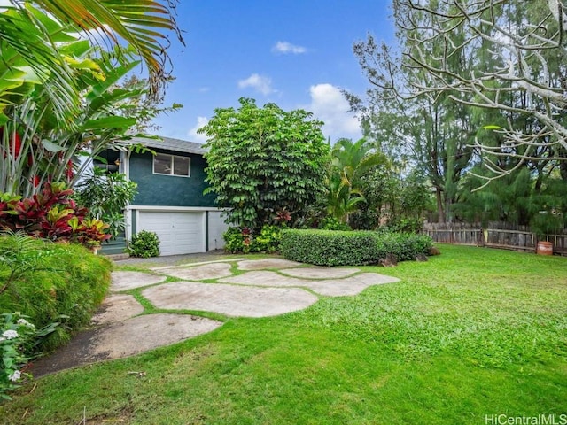 view of yard featuring a garage