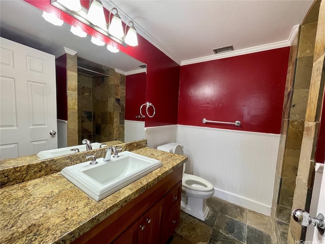 2215 Aloha Dr Unit 701, Honolulu, HI 96815 - bathroom featuring tiled shower, wainscoting, ornamental molding, toilet, and stone finish flooring