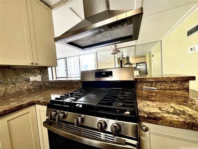 2215 Aloha Dr Unit 701, Honolulu, HI 96815 - kitchen with stainless steel gas range oven, wall chimney range hood, and tasteful backsplash