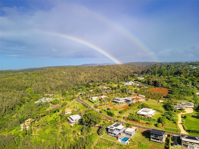 drone / aerial view featuring a forest view