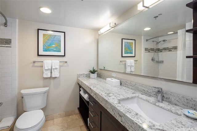 bathroom featuring tile patterned floors, vanity, a shower with shower curtain, and toilet