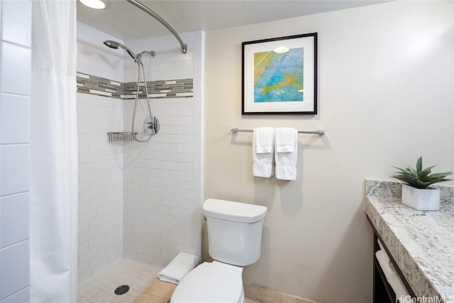 bathroom featuring a shower with curtain and toilet